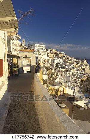 Santorini, Greek Islands, Fira, Cyclades, Greece, Europe, Terraces and resorts in the village of Fira on the steep hillside of Santorini Island overlooking the Aegean Sea. View Large Photo Image Stock Image - Santorini, Greek Islands, Fira, Cyclades, Greece, Europe, Terraces and resorts in the village of Fira on the steep hillside of Santorini Island overlooking the Aegean Sea.. Fotosearch