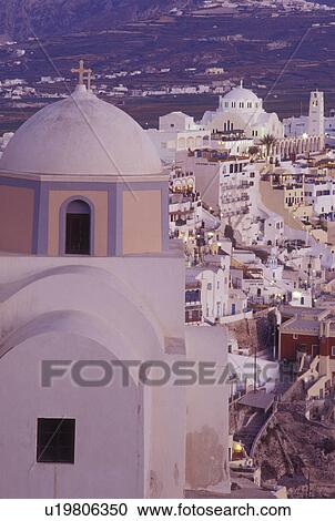 Stock Image -  Santorini, Greek Islands, Fira, Cyclades, Greece, Europe, Scenic view of the village of Fira from a church on the steep hillside of Santorini Island on the Aegean Sea.. Fotosearch