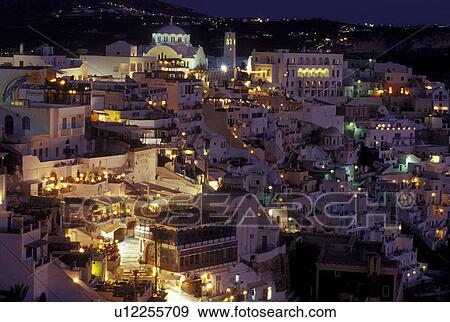 Stock Photo -  Santorini, Greek Islands, Fira, Cyclades, Greece, Europe, Village of Fira on the steep hillside of Santorini Island in the evening on the Aegean Sea.. Fotosearch