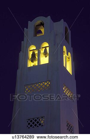 Santorini, Greek Islands, Fira, Cyclades, Greece, Europe, Bell tower illuminated at night on a whitewashed church in the village of Fira on Santorini Island on the Aegean Sea. View Large Photo Image Stock Photo - Santorini, Greek Islands, Fira, Cyclades, Greece, Europe, Bell tower illuminated at night on a whitewashed church in the village of Fira on Santorini Island on the Aegean Sea. . Fotosearch