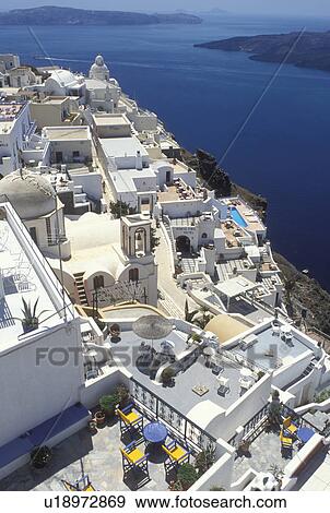 Santorini, Greek Islands, Fira, Cyclades, Greece, Europe, Terraces and resorts in the village of Fira on the steep hillside of Santorini Island overlooking the Aegean Sea. View Large Photo Image Stock Photo - Santorini, Greek Islands, Fira, Cyclades, Greece, Europe, Terraces and resorts in the village of Fira on the steep hillside of Santorini Island overlooking the Aegean Sea.. Fotosearch