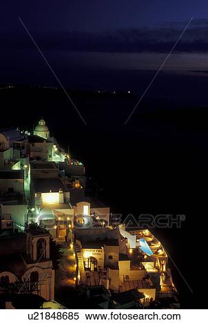 Stock Photography -  Santorini, Greek Islands, Fira, Cyclades, Greece, Europe, Village of Fira at night on the steep hillside of Santorini Island on the Aegean Sea.. Fotosearch