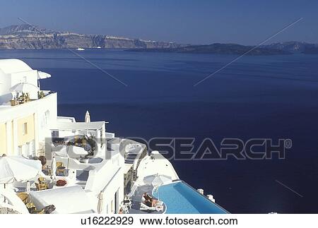 Santorini, Greek Islands, Oia, Cyclades, Greece, Europe, Resort with pool in the village of Oia overlooking the Aegean Sea on Santorini Island. View Large Photo Image Stock Photo - Santorini, Greek Islands, Oia, Cyclades, Greece, Europe, Resort with pool in the village of Oia overlooking the Aegean Sea on Santorini Island.. Fotosearch
