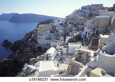 Santorini, Greek Islands, Oia, Cyclades, Greece, Europe, Whitewashed buildings in the village of Oia on the steep hillside of Santorini Island on the Aegean Sea. View Large Photo Image Stock Photo - Santorini, Greek Islands, Oia, Cyclades, Greece, Europe, Whitewashed buildings in the village of Oia on the steep hillside of Santorini Island on the Aegean Sea.. Fotosearch
