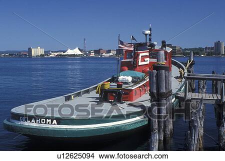 Sault Ste. Marie, MI, Michigan, Upper Peninsula, U. P UP, Red and green tugboat docked along St. Marys River in Sault Sainte Marie. View Large Photo Image Picture - Sault Ste. Marie, MI, Michigan, Upper Peninsula, U. P UP, Red and green tugboat docked along St. Marys River in Sault Sainte Marie.. Fotosearch