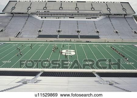 Stock Photo -  stadium, East Lansing, MI, Michigan, MSU, Football team practicing at Spartans Football Stadium on the campus of Michigan State University.. Fotosearch