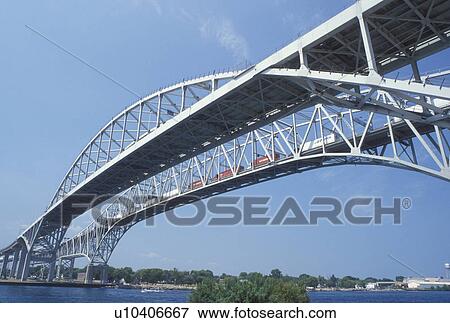 steel bridge, Port Huron, MI, Lake Huron, Michigan, Blue Water International Bridge spans the St. Clair River at Port Huron. View Large Photo Image Stock Photo - steel bridge, Port Huron, MI, Lake Huron, Michigan, Blue Water International Bridge spans the St. Clair River at Port Huron.. Fotosearch
