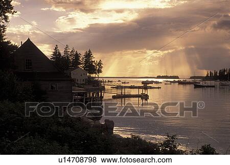 Stock Photo -  Stonington, ME, Maine, Deer Isle, Scenic sunset over Burnt Cove in the lobstering village of Stonington on Deer Isle on the Atlantic Ocean.. Fotosearch