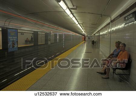 subway, Toronto, Canada, Ontario, Two women waiting for a train at Donlands Subway Station in Toronto. View Large Photo Image Stock Photo - subway, Toronto, Canada, Ontario, Two women waiting for a train at Donlands Subway Station in Toronto. . Fotosearch