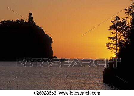 sunrise, Lake Superior, Two Harbors, MN, North Shore Drive, Minnesota, Split Rock Lighthouse situated on a high cliff on the north shore of Lake Superior at Split Rock Lighthouse State Park in Two Harbors at sunrise. View Large Photo Image Stock Image - sunrise, Lake Superior, Two Harbors, MN, North Shore Drive, Minnesota, Split Rock Lighthouse situated on a high cliff on the north shore of Lake Superior at Split Rock Lighthouse State Park in Two Harbors at sunrise.. Fotosearch