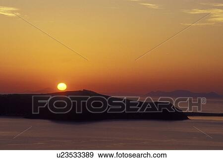 Stock Photo -  sunset, Santorini, Greece, Greek Islands, Cyclades, Europe, Sunset overlooking the Aegean Sea from Santorini Island.. Fotosearch