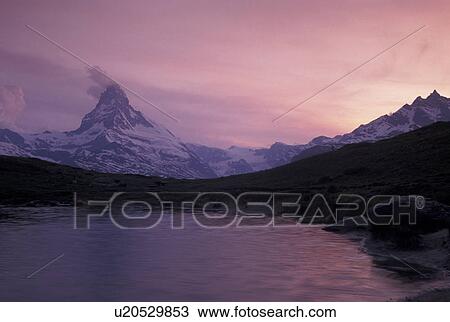 sunset, Switzerland, Matterhorn, Valais, Alps, Sunset by a small lake in Leisee above Zermatt with a scenic view of the Matterhorn in the Swiss Alps. View Large Photo Image Stock Image - sunset, Switzerland, Matterhorn, Valais, Alps, Sunset by a small lake in Leisee above Zermatt with a scenic view of the Matterhorn in the Swiss Alps.. Fotosearch