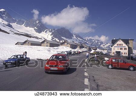 Switzerland, Alps, Furka Pass, Uri, Restaurant in the snow at the summit of the Furka Mountain Pass Road in the Swiss Alps in the summer. View Large Photo Image Stock Image - Switzerland, Alps, Furka Pass, Uri, Restaurant in the snow at the summit of the Furka Mountain Pass Road in the Swiss Alps in the summer.. Fotosearch