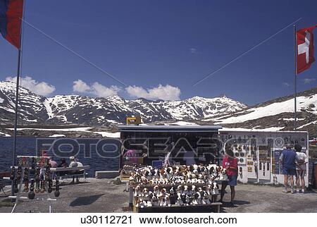 Switzerland, Alps, St. Gotthard Pass Road, Ticino, Souvenirs of Switzerland on display, for sale, on the summit of Saint Gotthard Mountain Pass in the scenic Swiss Alps in the summer. View Large Photo Image Stock Image - Switzerland, Alps, St. Gotthard Pass Road, Ticino, Souvenirs of Switzerland on display, for sale, on the summit of Saint Gotthard Mountain Pass in the scenic Swiss Alps in the summer.. Fotosearch