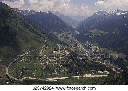 Switzerland, Alps, Ticino, Airolo, Val Leventina, St. Gotthard Pass Road, Mountain road switchbacks it's way through the Saint Gotthard Mountain Pass in the scenic Swiss Alps. View Large Photo Image Picture - Switzerland, Alps, Ticino, Airolo, Val Leventina, St. Gotthard Pass Road, Mountain road switchbacks it's way through the Saint Gotthard Mountain Pass in the scenic Swiss Alps.. Fotosearch