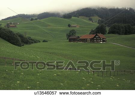Stock Photo -  Switzerland, Appenzell, Europe, Scenic view of the hilly green grassland surrounding the farms of Appenzell.. Fotosearch