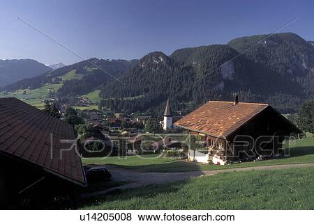 Switzerland, Berne, Bern, Scenic view of the village of Saanen in the Bernese Oberland. View Large Photo Image Stock Photo - Switzerland, Berne, Bern, Scenic view of the village of Saanen in the Bernese Oberland.. Fotosearch