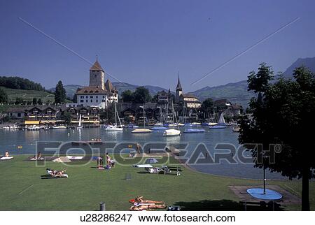Switzerland, Berne, Bern, Thunersee, Public beach along Lake Thun in the town of Spiez in the Bernese Oberland. View Large Photo Image Stock Photo - Switzerland, Berne, Bern, Thunersee, Public beach along Lake Thun in the town of Spiez in the Bernese Oberland.. Fotosearch