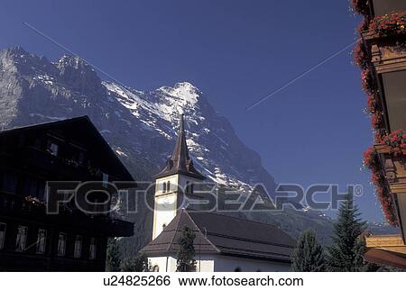 Switzerland, Eiger, Grindenwald, Berne, Bern, Bernese Alps, church, balcony with flowers, mountain, Bernese Oberland. View Large Photo Image Stock Photograph - Switzerland, Eiger, Grindenwald, Berne, Bern, Bernese Alps, church, balcony with flowers, mountain, Bernese Oberland.. Fotosearch