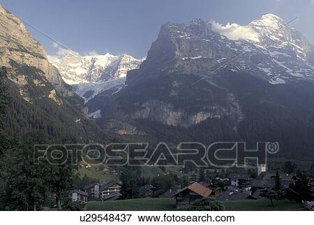 Switzerland, Grindelwald, Bern, Bernese Alps, Europe, Scenic view of the picturesque village of Grindelwald in the Bernese Alps. View Large Photo Image Stock Photo - Switzerland, Grindelwald, Bern, Bernese Alps, Europe, Scenic view of the picturesque village of Grindelwald in the Bernese Alps.. Fotosearch