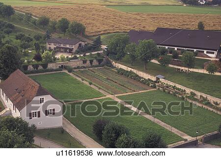 Stock Photograph -  Switzerland, Jura, Scenic view of a farm in the village of Porrentruy from the medieval castle . Fotosearch