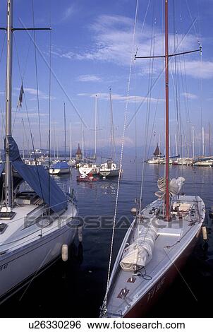 Switzerland, La Cote, Vaud, Lake Geneva, Boats docked in the harbor along the lakefront in the town of Morges on Lac Leman. View Large Photo Image Stock Photograph - Switzerland, La Cote, Vaud, Lake Geneva, Boats docked in the harbor along the lakefront in the town of Morges on Lac Leman.. Fotosearch