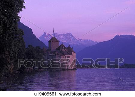 Switzerland, Lake Geneva, Chateau de Chillon, Alps, Montreux, Vaud, Scenic view of Chateau de Chillon an 13th century fortress at sunset surrounded by the Alps along the lakeshore of Lac Leman in the Canton of Vaud. View Large Photo Image Stock Image - Switzerland, Lake Geneva, Chateau de Chillon, Alps, Montreux, Vaud, Scenic view of Chateau de Chillon an 13th century fortress at sunset surrounded by the Alps along the lakeshore of Lac Leman in the Canton of Vaud. . Fotosearch