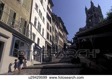 Stock Photo -  Switzerland, Lausanne, Vaud, Narrow steep street in downtown Lausanne.. Fotosearch