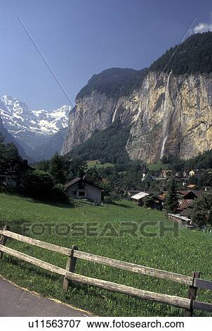 Stock Photo -  Switzerland, Lauterbrunnen, Bern, Bernese Alps, Bernese Oberland, Europe, Scenic view of the village of Lauterbrunnen in the Bernese Alps.. Fotosearch
