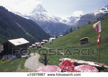 Stock Photo -  Switzerland, Matterhorn, Cervin, Valais, Alps, Findeln, Scenic view the Matterhorn from an outdoor cafT in the mountain village of Findeln above Zermatt in the Swiss Alps.. Fotosearch