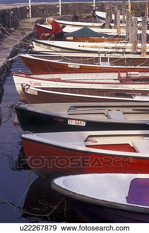 Stock Photo -  Switzerland, Ticino, Ascona, Rowboats docked in the harbor along the lakefront of Lake Maggiore in the city of Ascona.. Fotosearch