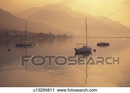 Switzerland, Ticino, Locarno, Scenic view of Lake Maggiore along the city of Locarno. View Large Photo Image Stock Image -  Switzerland, Ticino, Locarno, Scenic view of Lake Maggiore along the city of Locarno.. Fotosearch