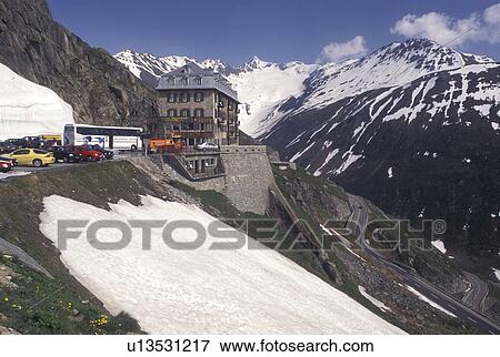 Switzerland, Valais, Alps, Furka Pass, Belvedere Restaurant in the snow at the summit of the Furka Mountain Pass Road in the Swiss Alps in the summer. View Large Photo Image Stock Photo - Switzerland, Valais, Alps, Furka Pass, Belvedere Restaurant in the snow at the summit of the Furka Mountain Pass Road in the Swiss Alps in the summer.. Fotosearch