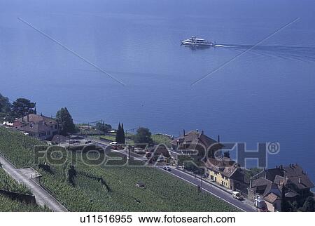 Switzerland, Vaud, Lake Geneva, Lavaux, Scenic view of an excursion steamer boat cruising along the lakeshore of Lac Leman from the steep slopes of the vineyards of Lavaux in the Canton of Vaud. View Large Photo Image Stock Photography - Switzerland, Vaud, Lake Geneva, Lavaux, Scenic view of an excursion steamer boat cruising along the lakeshore of Lac Leman from the steep slopes of the vineyards of Lavaux in the Canton of Vaud. . Fotosearch