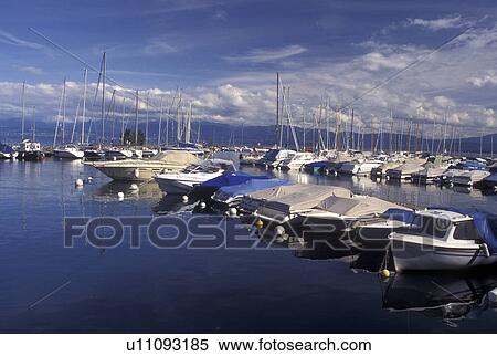 Stock Photography -  Switzerland, Vaud, Rolle, Lac Leman, La Cote, Boats docked at a marina in the harbor of Rolle on Lake Geneva in the Canton of Vaud. . Fotosearch