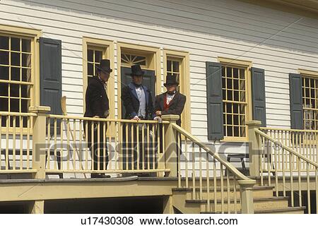 Stock Photo -  Thunder Bay, Canada, Ontario, Men dressed in authentic costumes celebrate Scottish Days outside the Great Hall at Old Fort William, Fur Trading Post, in Thunder Bay.. Fotosearch