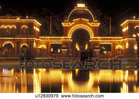 Tivoli Gardens, Copenhagen, Denmark, Scandinavia, Sjaelland, Europe, Lights at the entrance to Tivoli Amusement Park reflect in the pond at night. View Large Photo Image Stock Photo - Tivoli Gardens, Copenhagen, Denmark, Scandinavia, Sjaelland, Europe, Lights at the entrance to Tivoli Amusement Park reflect in the pond at night.. Fotosearch