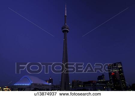 Stock Photo -  Toronto, Canada, Ontario, CN Tower and Skydome in downtown Toronto in the evening.. Fotosearch