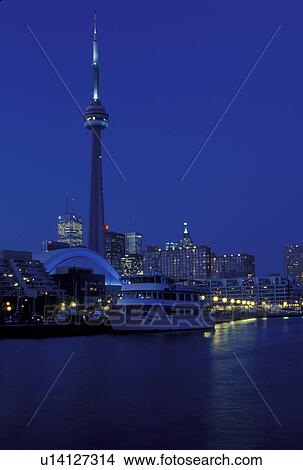 Toronto, Canada, Ontario, Lake Ontario, CN Tower and skyline of downtown Toronto in the evening along Toronto Inner Harbor on Lake Ontario. View Large Photo Image Picture - Toronto, Canada, Ontario, Lake Ontario, CN Tower and skyline of downtown Toronto in the evening along Toronto Inner Harbor on Lake Ontario.. Fotosearch