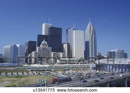 Stock Image -  Toronto, Canada, Ontario, Skyline of downtown Toronto along the expressway. . Fotosearch
