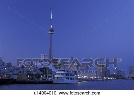 Toronto, Ontario, Canada, Lake Ontario, CN Tower and skyline of downtown Toronto in the evening along Toronto Inner Harbor on Lake Ontario. View Large Photo Image Stock Image - Toronto, Ontario, Canada, Lake Ontario, CN Tower and skyline of downtown Toronto in the evening along Toronto Inner Harbor on Lake Ontario.. Fotosearch
