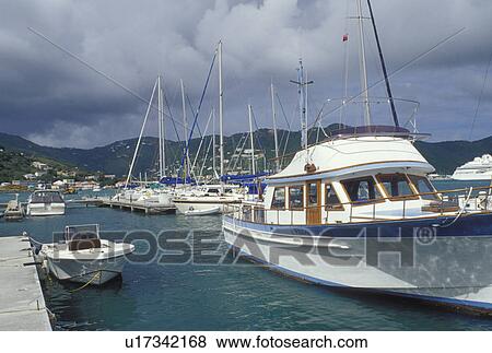 Tortola, British Virgin Islands, Road Town, Caribbean, BVI, Boats docked at a yacht club on the Caribbean Sea on the island of Tortola. View Large Photo Image Stock Photo - Tortola, British Virgin Islands, Road Town, Caribbean, BVI, Boats docked at a yacht club on the Caribbean Sea on the island of Tortola.. Fotosearch