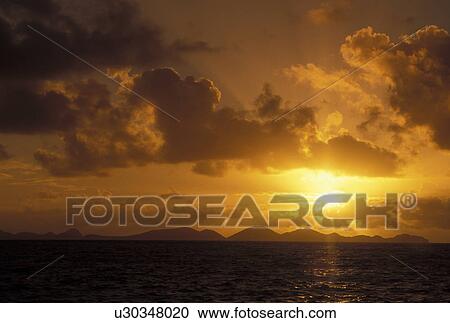 Tortola, sunrise, British Virgin Islands, Road Town, Caribbean, BVI, Scenic view of Peter island at sunrise over the Caribbean Sea from the island of Tortola. View Large Photo Image Stock Image - Tortola, sunrise, British Virgin Islands, Road Town, Caribbean, BVI, Scenic view of Peter island at sunrise over the Caribbean Sea from the island of Tortola.. Fotosearch