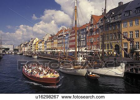 Tour boat, Copenhagen, Denmark, Scandinavia, Sjaelland, canal, Europe, Tour boat cruises Nyhavn (New Harbor) along the scenic city of Copenhagen View Large Photo Image Stock Photo - Tour boat, Copenhagen, Denmark, Scandinavia, Sjaelland, canal, Europe, Tour boat cruises Nyhavn (New Harbor) along the scenic city of Copenhagen. Fotosearch