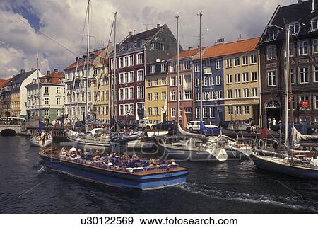 tour boat, Copenhagen, Denmark, Scandinavia, Sjaelland, canal, Europe, Tour boat cruises Nyhavn (New Harbor) along the scenic city of Copenhagen View Large Photo Image Stock Photo - tour boat, Copenhagen, Denmark, Scandinavia, Sjaelland, canal, Europe, Tour boat cruises Nyhavn (New Harbor) along the scenic city of Copenhagen. Fotosearch