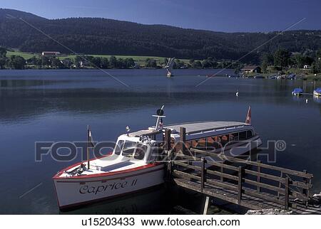 tour boat, Vallee de Joux, Switzerland, Vaud, Excursion boat docked along the lakefront of Lac de Joux in Le Pont in the Jura mountain region. View Large Photo Image Stock Image - tour boat, Vallee de Joux, Switzerland, Vaud, Excursion boat docked along the lakefront of Lac de Joux in Le Pont in the Jura mountain region.. Fotosearch