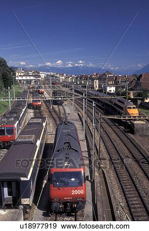 train, TGV, Switzerland, Lausanne, Vaud, Trains and TGV parked along train tracks at train station in Lausanne. View Large Photo Image Stock Photo - train, TGV, Switzerland, Lausanne, Vaud, Trains and TGV parked along train tracks at train station in Lausanne.. Fotosearch