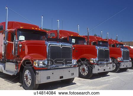 trucks, NH, Berlin, New Hampshire, Red trucks parked in a row. View Large Photo Image Picture - trucks, NH, Berlin, New Hampshire, Red trucks parked in a row.. Fotosearch