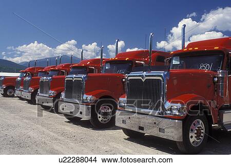 trucks, NH, Berlin, New Hampshire, Red trucks parked in a row. View Large Photo Image Picture - trucks, NH, Berlin, New Hampshire, Red trucks parked in a row.. Fotosearch