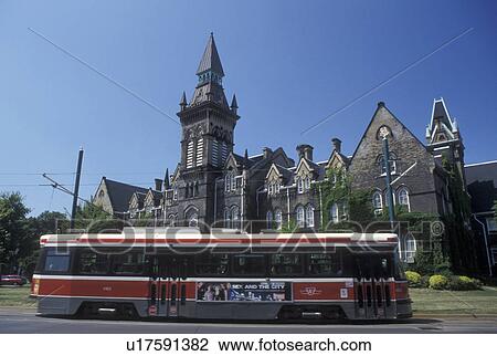 Stock Image -  university, Toronto, Canada, Ontario, Trolley passes in front of the University of Toronto St. George Campus in downtown Toronto. . Fotosearch